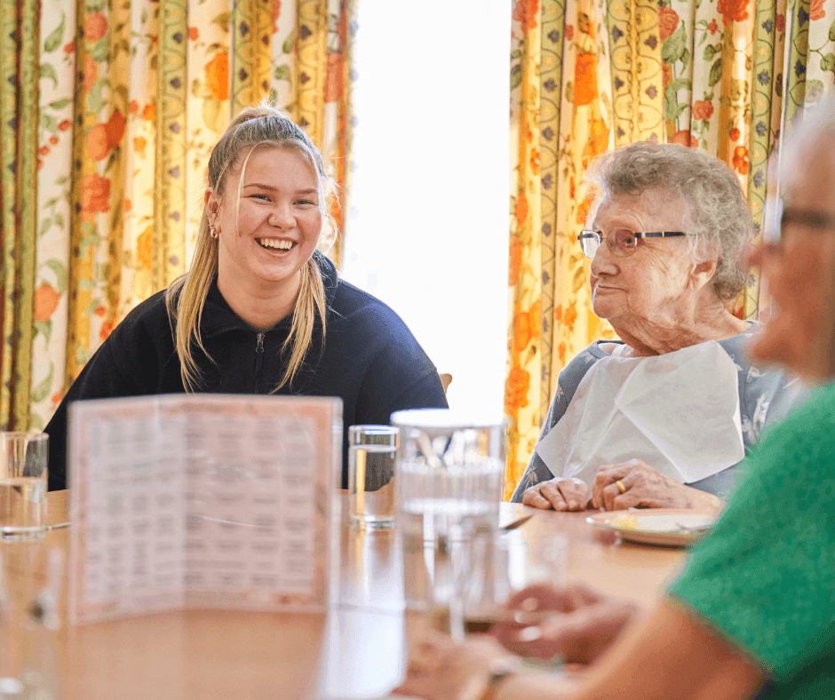 Young carer laughing with service users