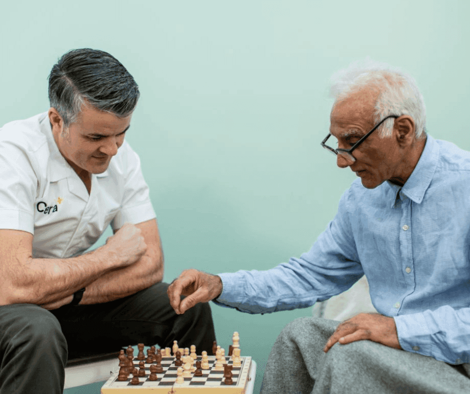 Cera Carer Playing Chess with Service User.png
